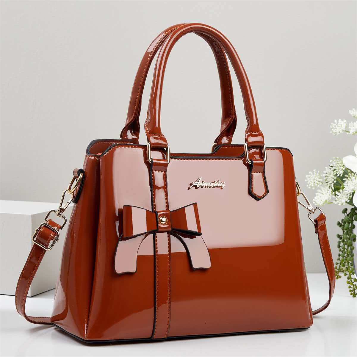 Bolso de mano de arco de piel brillante, bolso de hombro casual de moda, bolso de madre, temperamento, bolso de mochila transfronterizo