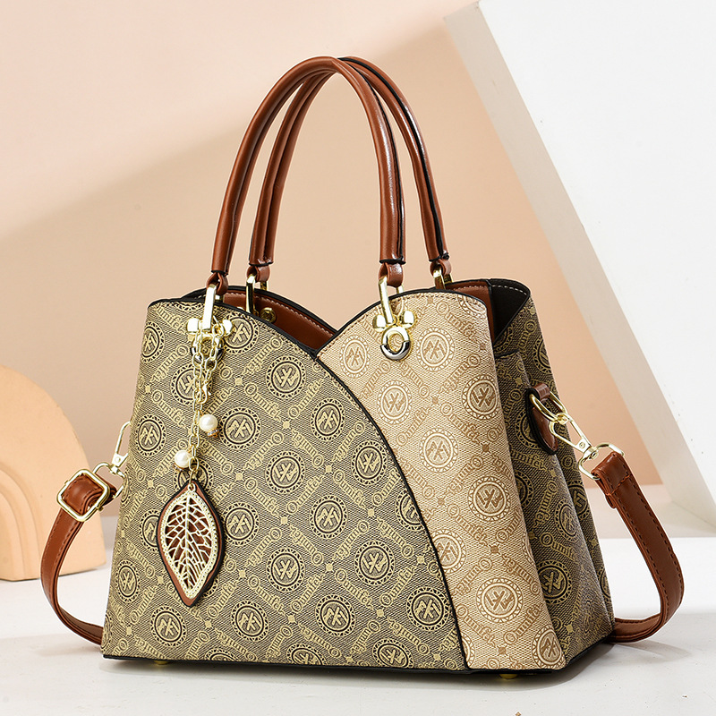 2025 verano nuevo bolso de moda de mediana edad bolso de mujer bolso de hombro mochila atmósfera bolso de madre universal