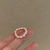 Organic small design fashionable ring from pearl, light luxury style, on index finger