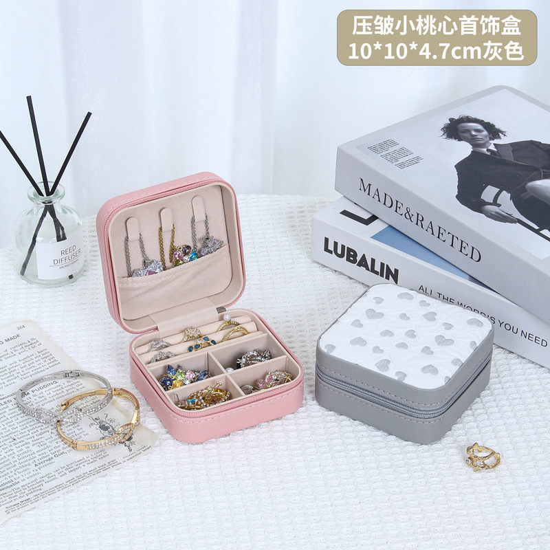 Nueva caja de joyería portátil dulce alta sensación de joyería collar anillo pendientes joyería almacenamiento transfronterizo