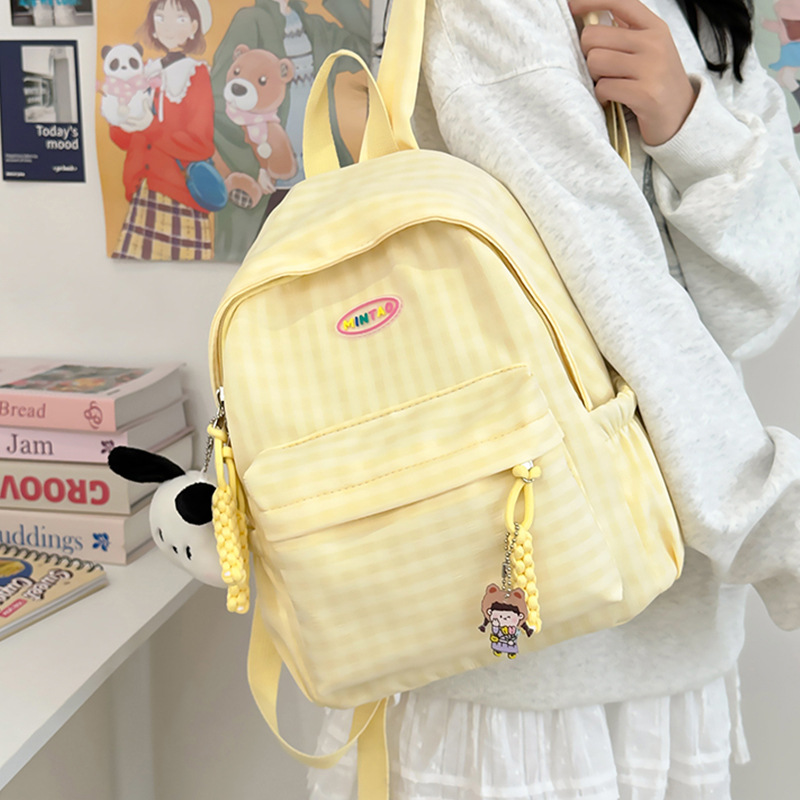 Mochila nueva mochila de todo fósforo, estudiante de secundaria japonesa, estudiante de secundaria, bolso de estudiante de viaje, versión coreana, mochila de color sólido simple al por mayor
