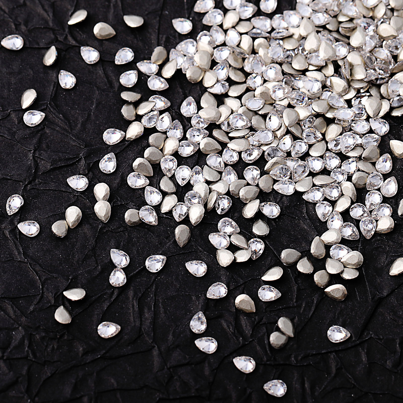 Mini faceted zircon, white, 2*3mm teardrop