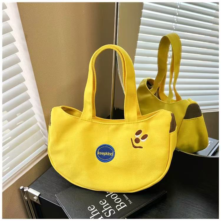Wholesale of new cute banana embroidered handbags, portable canvas bags for work and outings, small bags for mothers' miscellaneous items Wholesale of new cute banana embroidered handbags, portable canvas bags for work and outings, small bags for mothers' miscellaneous items