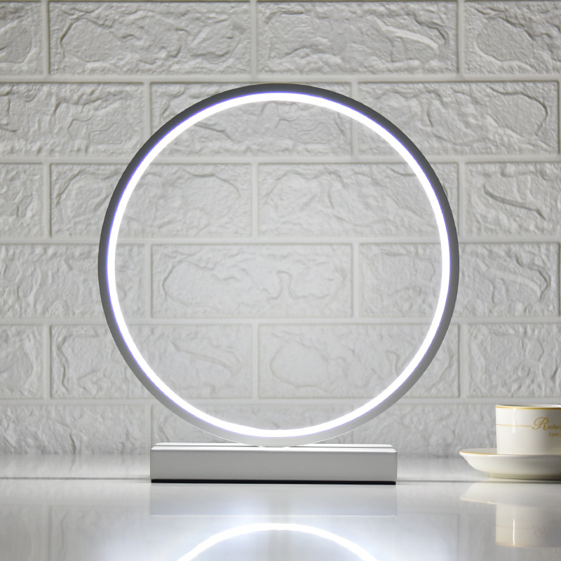 Lámpara de escritorio LED nórdica con luz ambiental, diseño circular, ideal para dormitorio o escritorio