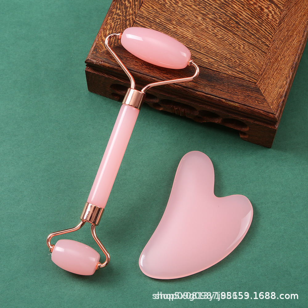 Rodillo facial de cristal en forma de corazón para masaje y lifting