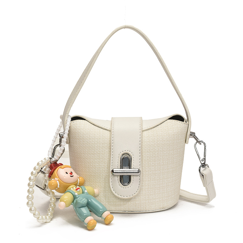 Bolso de hombro para niña de moda, muñeca linda, bolso de bebé colgante, nuevo mini bolso para niños 2025