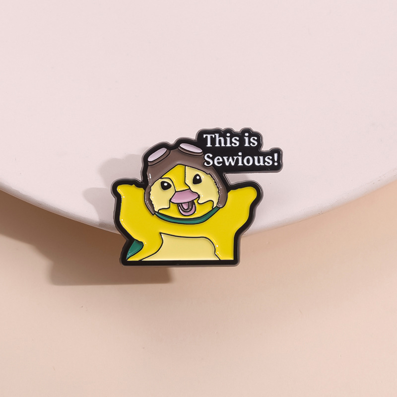 cartoon brooch