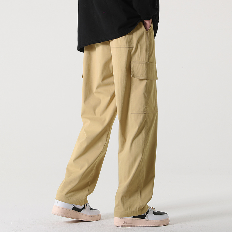 Pantalones rectos pantalones de pierna ancha para hombres primavera y otoño color sólido ropa de trabajo multibolsillos pantalones sueltos casuales de manga larga sensación de drapeado de moda