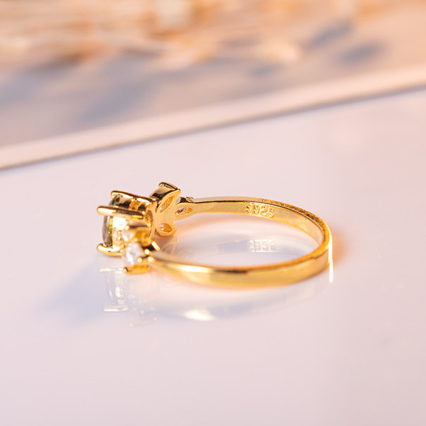 Golden ring with zircon