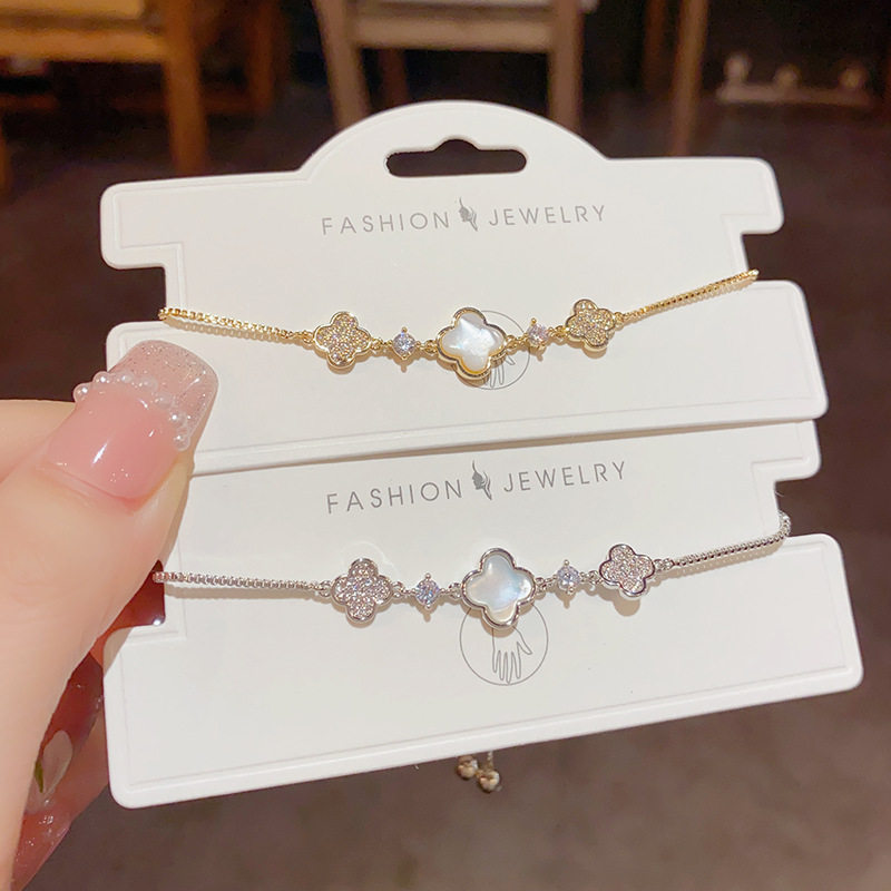 White imitation mother-of-pearl four-leaf clover bracelet with diamonds for women, exquisite and high-end, lucky clover, light luxury, niche and elegant jewelry