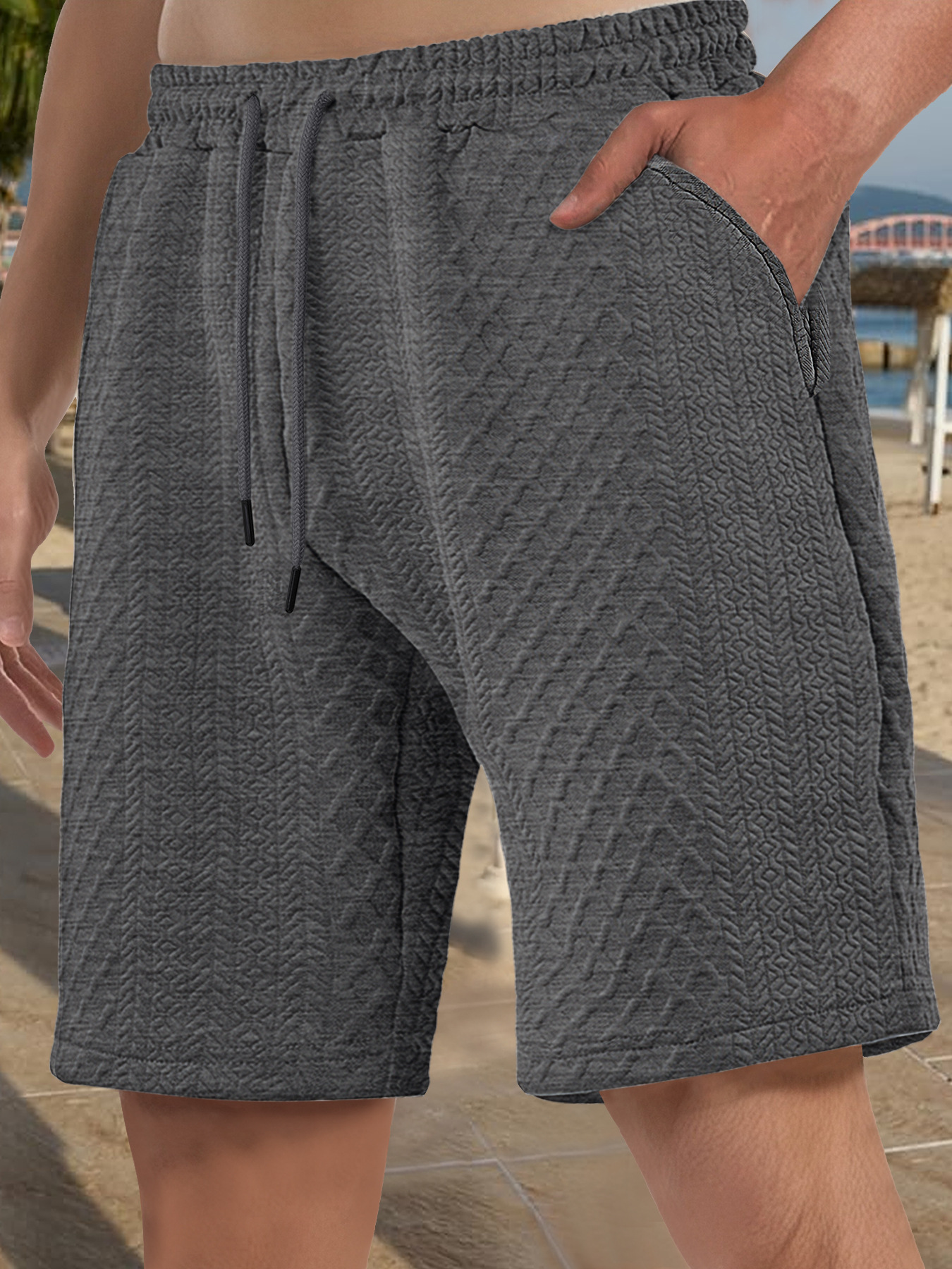 Europa y Estados Unidos ropa de hombre transfronteriza spot verano suelta pantalones cortos de color sólido jacquard correa de hombre casual pantalones cortos de playa