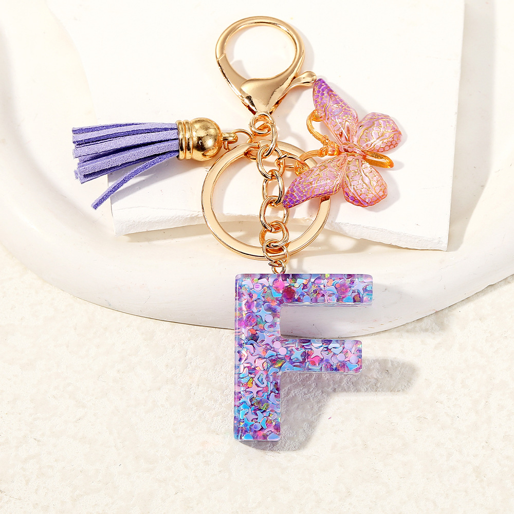 Mayorista transfronterizo mariposa esquinilla iniciales llavero de cristal goteo llavero de letras bolsos colgante