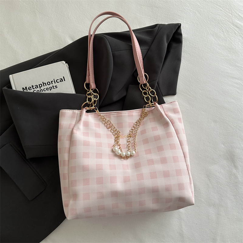 Bolsa de alto valor reticular para mujeres 2026 primavera y verano nuevo paquete de viaje de hombro universal bolso de nicho en línea bolsa de mujer