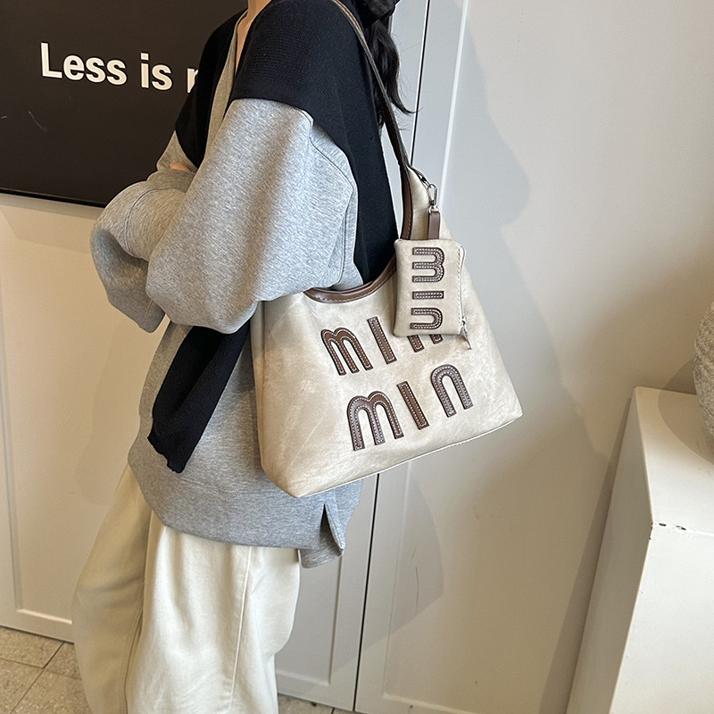 Alta sensación retro de gran capacidad 2024 nuevo estilo coreano bolso de mano de mujer de hombro de moda de viaje bolso de brazo