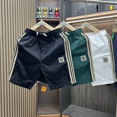 夏の新しいスタイルの速乾性通気性ショーツメンズファッションカジュアルシンプル多用途五分パンツユースビーチパンツ大きなパンツ