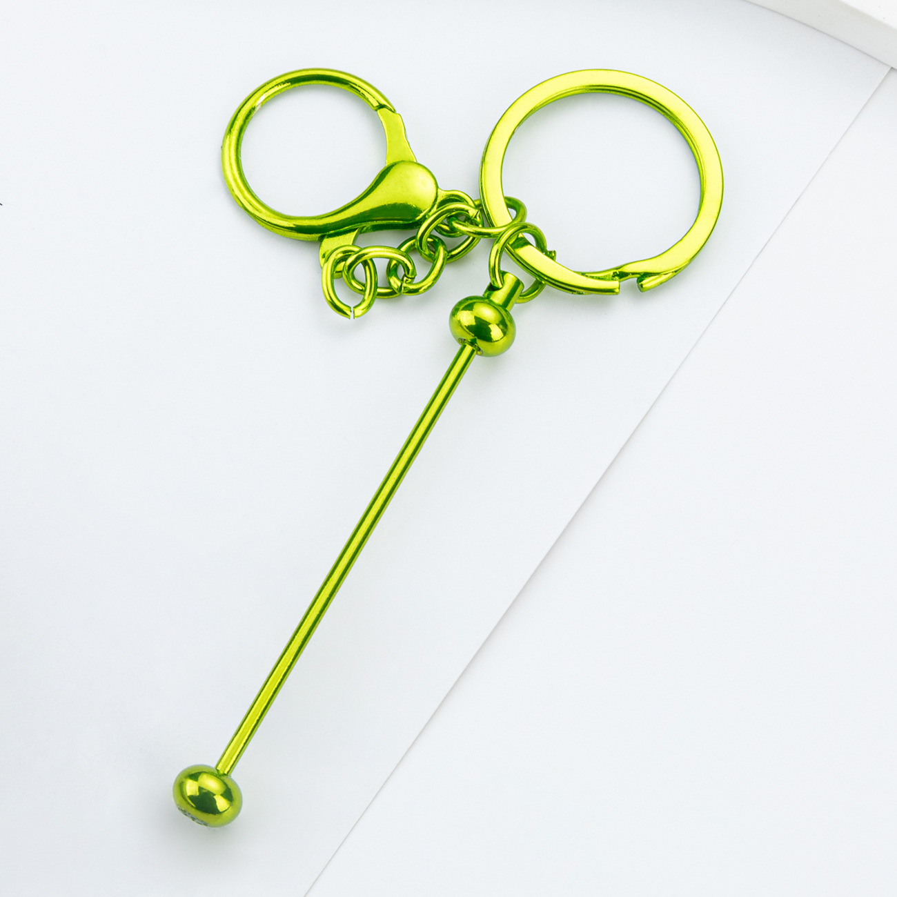 DIY cuentas llaveros auriculares caja de teléfono celular colgante llaveros de metal chapeado UV llaveros al por mayor spot