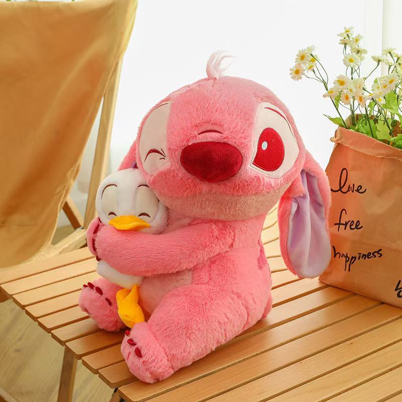 Nuevo estilo transfronterizo que sostiene pato Stitch peluche almohada para niños muñeca de trapo novia regalo de cumpleaños fabricante en stock