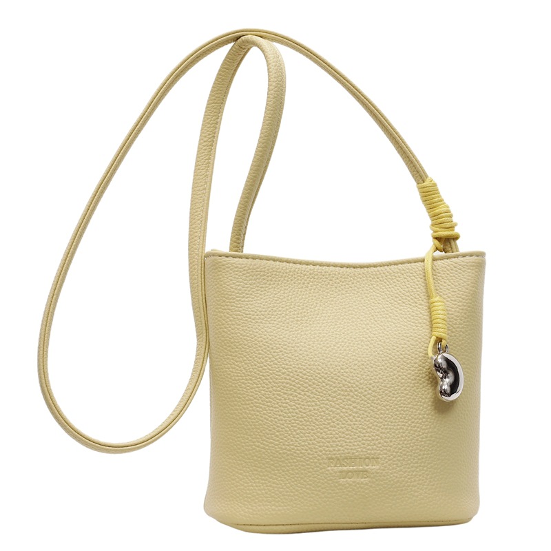 Bolsa de balde de moda de litchi para mujeres 2025 nuevo estilo de color sólido simple bolso de hombro mochila casual