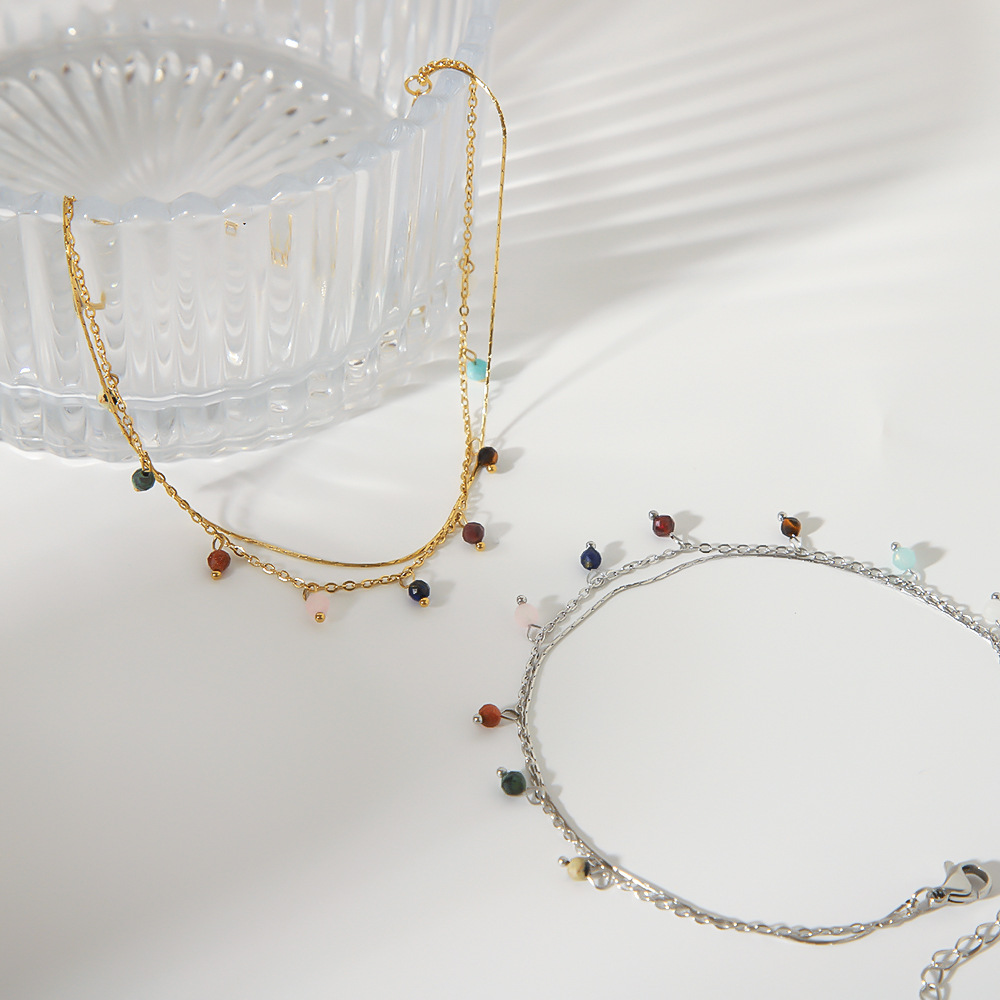 Estilo bohemio nuevo color de acero de titanio colgante de borla de jade natural doble tobillera casual adorno de pie chapado 18K