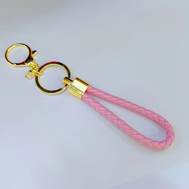 Ronda de la langosta hebilla PU cuero trenzado cuerda llavero hombres y mujeres amor llavero mano cuerda bolsa cordón fábrica directa al por mayor