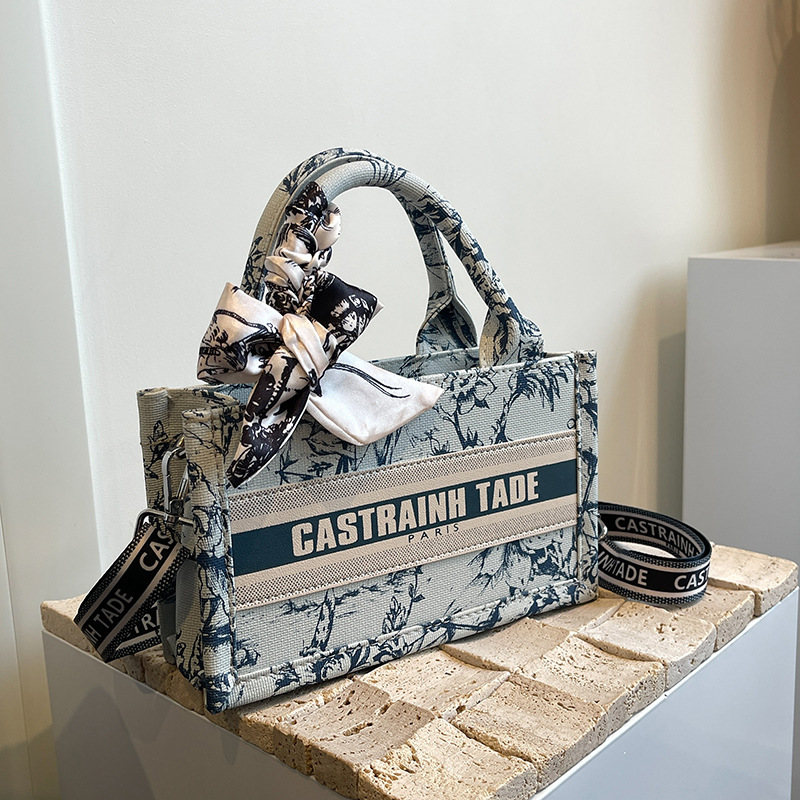 Bolsa de mano de comercio exterior transfronterizo para mujeres 2024 nueva moda simple impresión de letras mochila de hombro casual