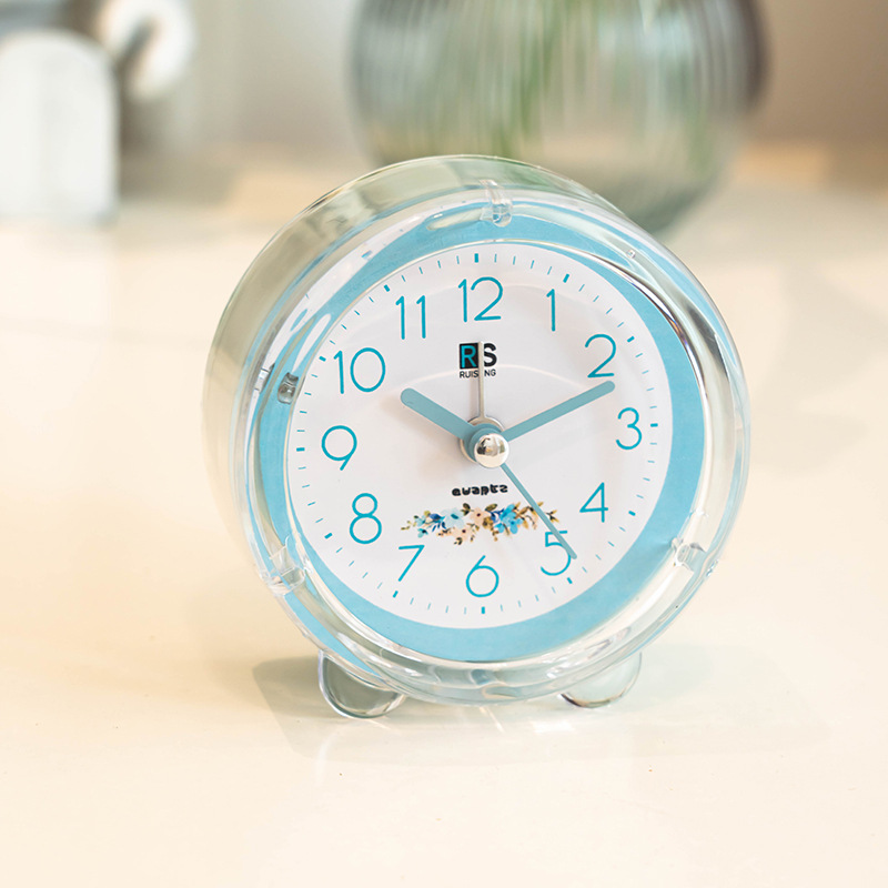 Ventas de fábrica reloj despertador de plástico redondo estudiante reloj de color caramelo con luz de dibujos animados claro reloj despertador fácil de llevar