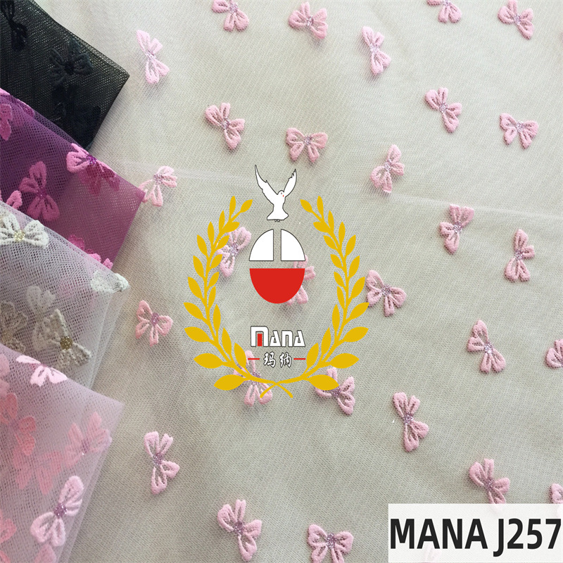 玛纳涤韩网布烫金胶印发泡蝴蝶结网纱面料可爱童装玩偶工艺品布料