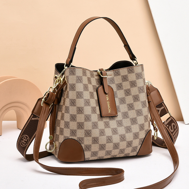 Bolsos bolsos de mujer bolsos de moda retro 2025 bolsos de nuevo estilo de gran capacidad y sentido de alta calidad bolso de cubo diagonal de un solo hombro mujeres