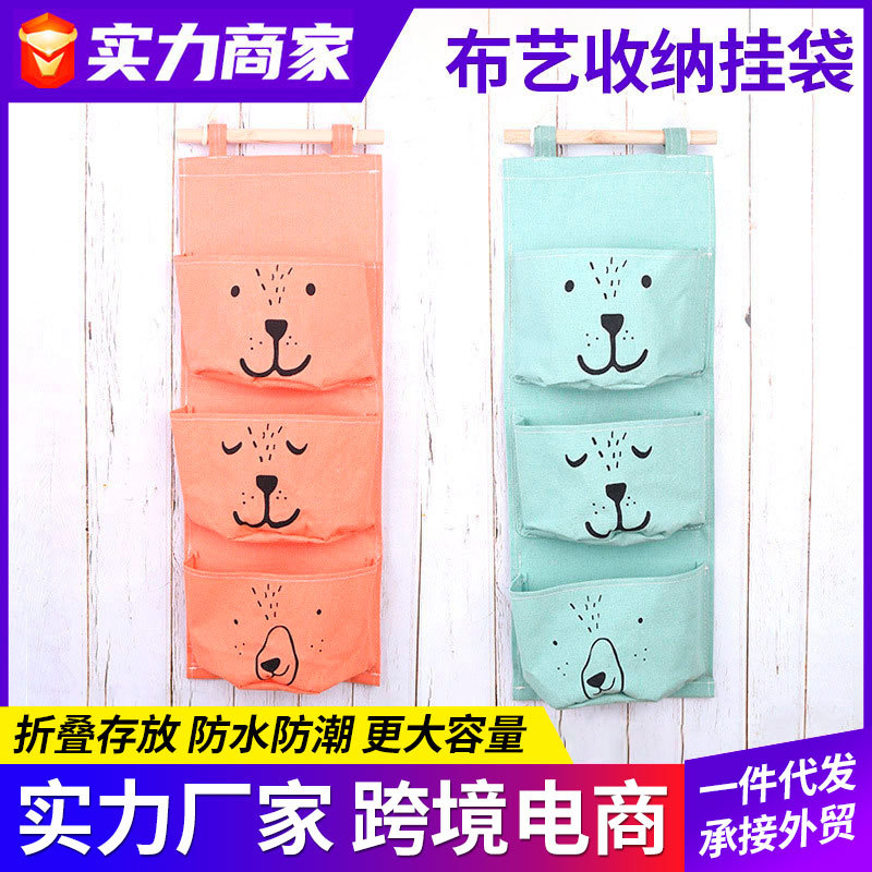 Suministro de algodón y lino de dibujos animados expresión de tres bolsillos de una pieza de almacenamiento bolsa colgante semicírculo bolsa colgante decorativa bolsa colgante