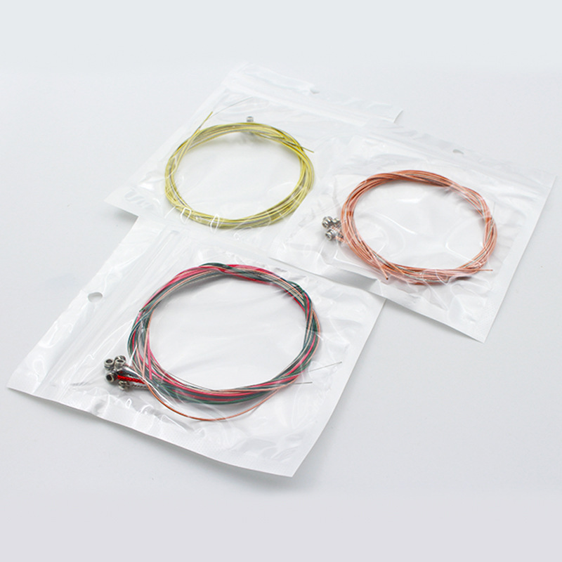 Cuerda de guitarra folk cuerda de latón cadena de color cobre rojo embalaje independiente cuerda de corte cuerda de cuerda herramienta de cambio de instrumento musical Accesorios