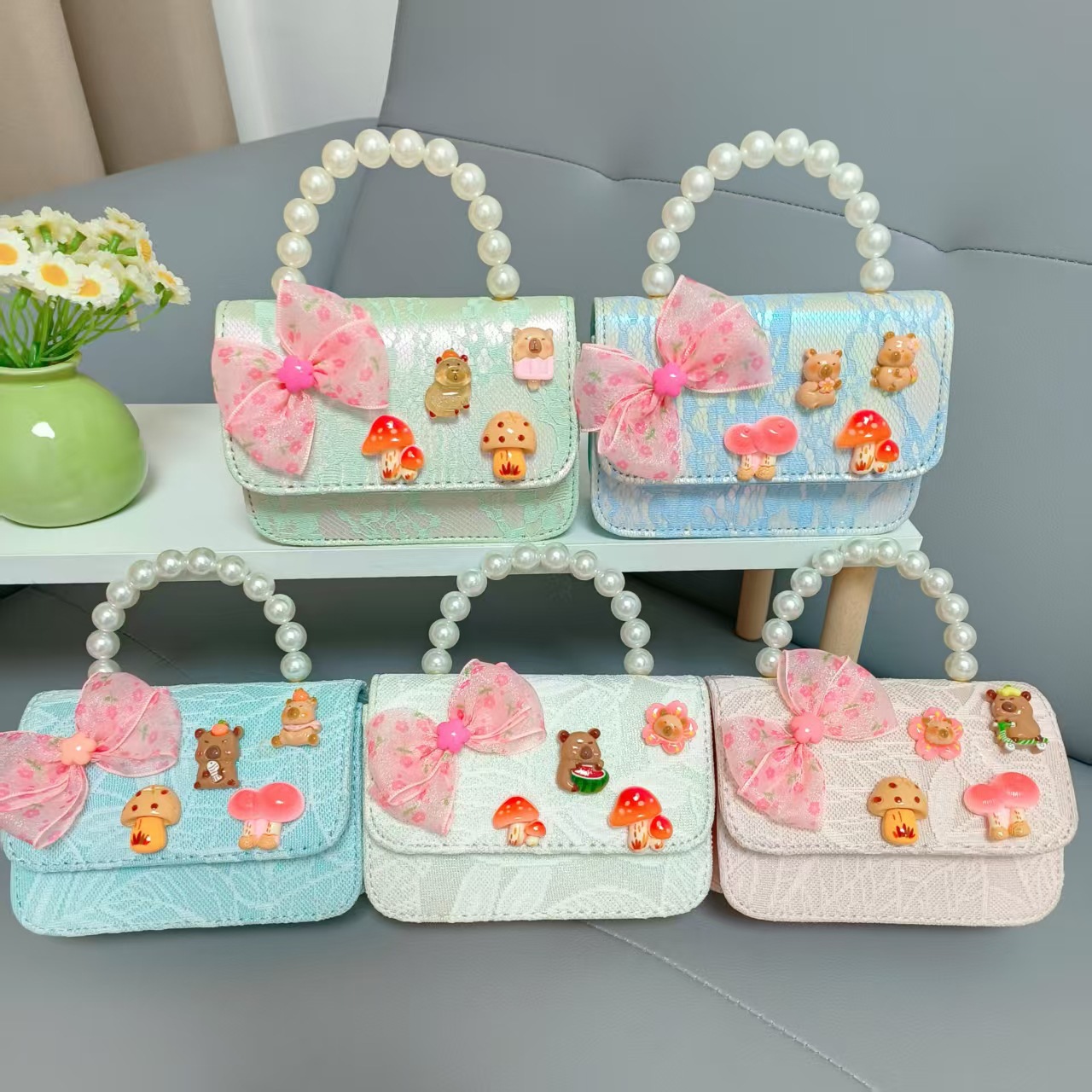 Bolsos para niños nuevos bolsos de perlas de arco para niñas bolsos de cinturón de estilo de fragancia bolsos de cadena bolsos de cambio bolsos