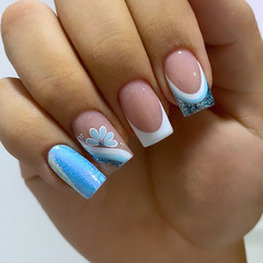 Customizable white edge French false nail stickers with dazzling light blue floral designs, perfect for trendy European and American fashionistas.