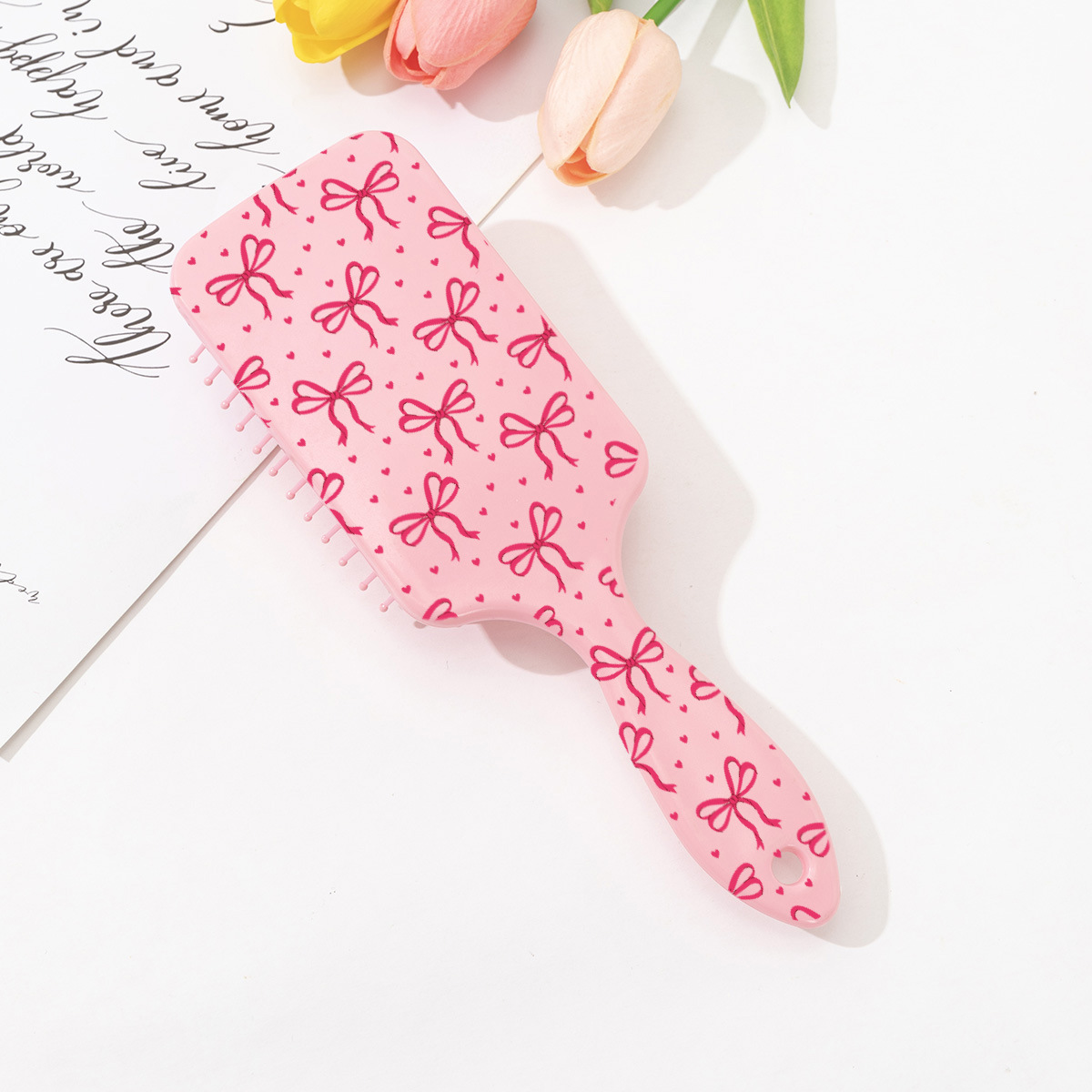 Estilo explosivo transfronterizo peine de colchón de aire con estampado de cereza con lazo lindo rosa peine de peluquería anti-nudo