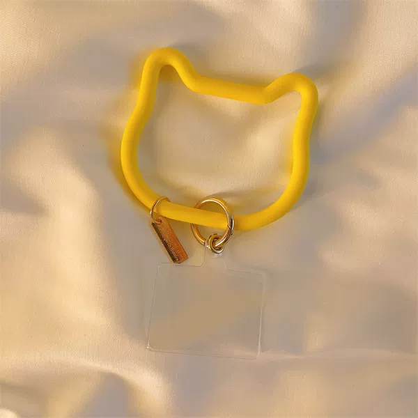 Yellow bracelet, cards, cat