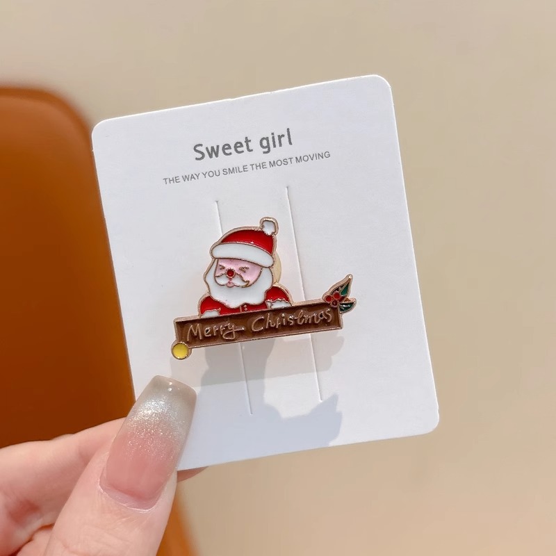 Broche de aleación de sentido avanzado japonés nueva insignia de personalidad de moda femenina de dibujos animados bolsa de Navidad accesorios de metal al por mayor