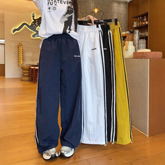 女性用アメリカン速乾パンツ、2025夏デザイン、ワイドレッグパンツ、カジュアルサイドストライプ、両着ストレートスポーツパンツ