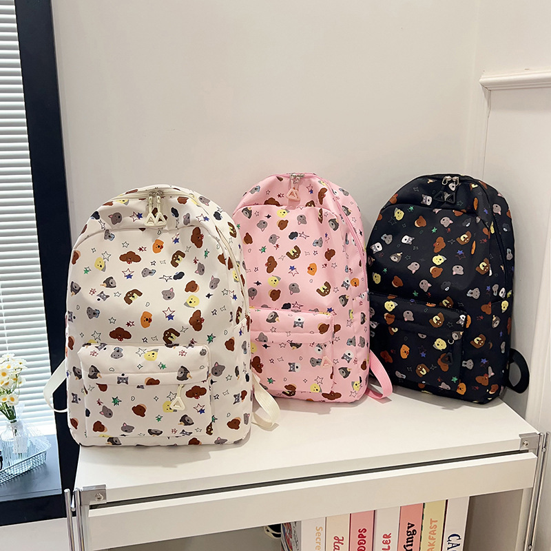 La nueva mochila con estampado de dibujos animados simple reduce la carga de los estudiantes de primaria y secundaria, pequeña mochila escolar fresca, mochila de viaje de ocio