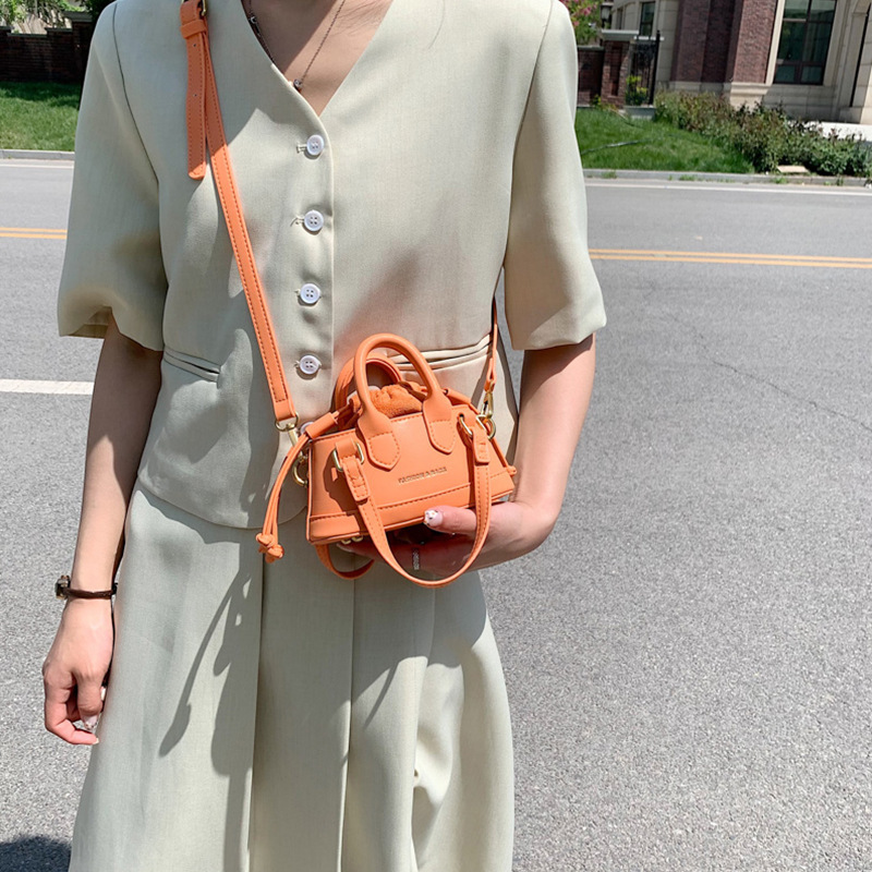 2022 Otoño e Invierno Nueva textura de los niños bolso de mano de moda europea y americana mini bolso de la cáscara transfronteriza bolsa de las mujeres