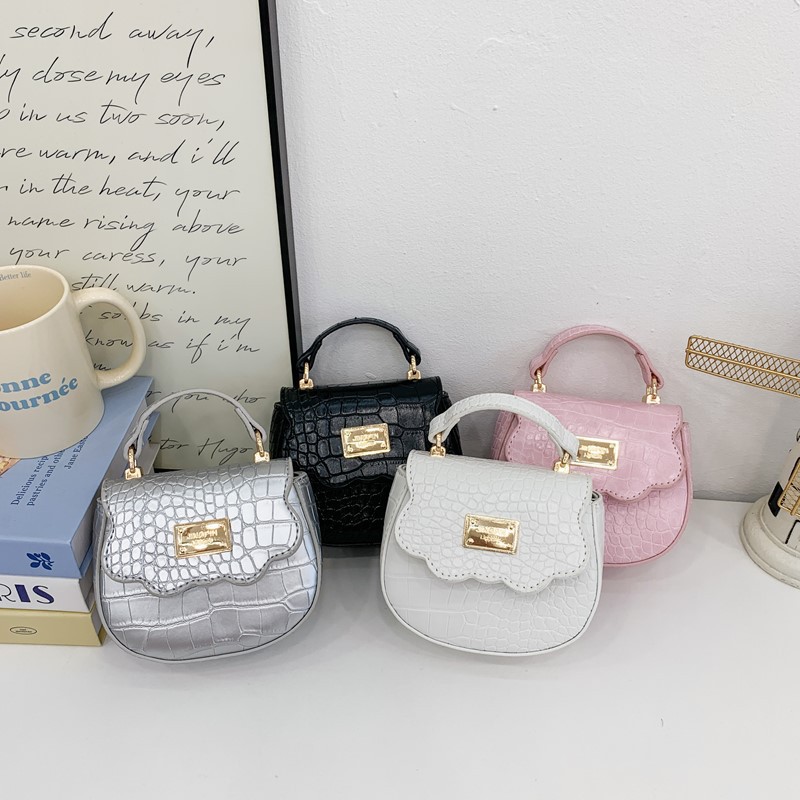 Bolso de hombro para niña de color sólido simple mini bolso de bebé lindo 2025 nuevo bolso de mensajero para niños de comercio exterior marea