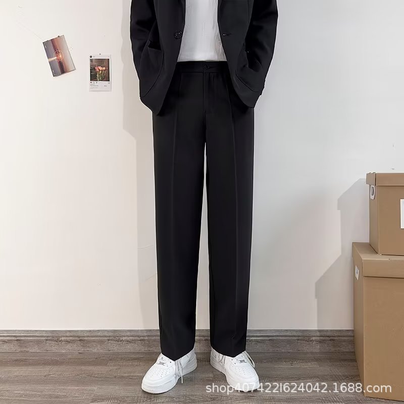 Black slim-fit men's straight-leg cropped casual trousers with a flattering drape; high-end suit trousers.