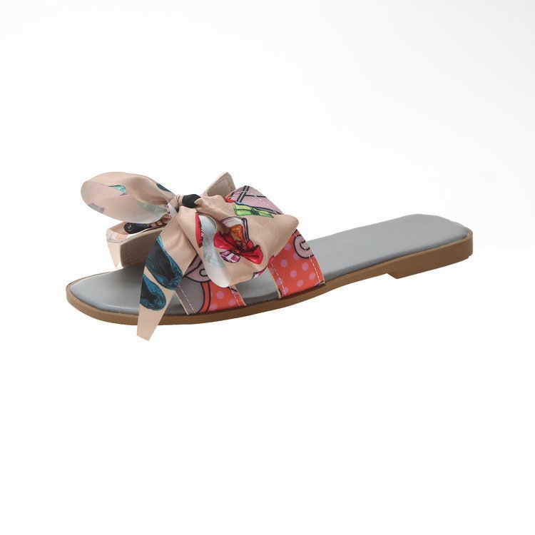 Cintas de colores zapatillas de arco de talón plano de verano para mujeres nuevas zapatillas de flores al por mayor