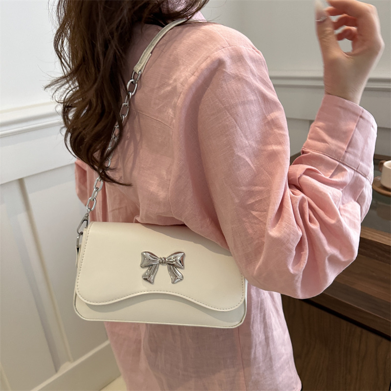 Este año popular bolso de arco para mujeres 2024 nuevo estilo extranjero primavera y verano mini bolso de cadena bolso de mochila