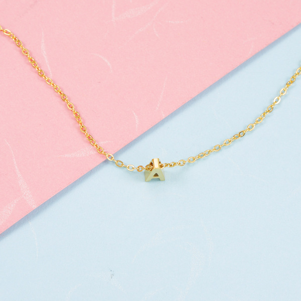 golden necklace with letters