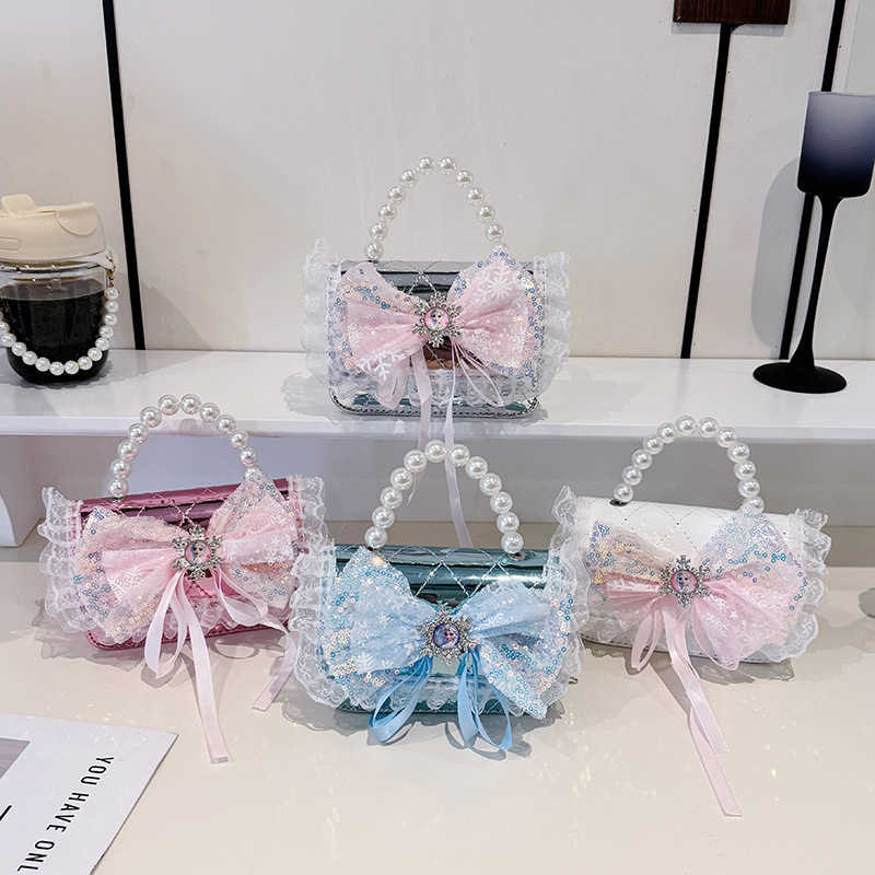2025 nuevo niño pequeño viento mochila de hombro pequeña niña espejo princesa bolso de perla bolso de dibujos animados