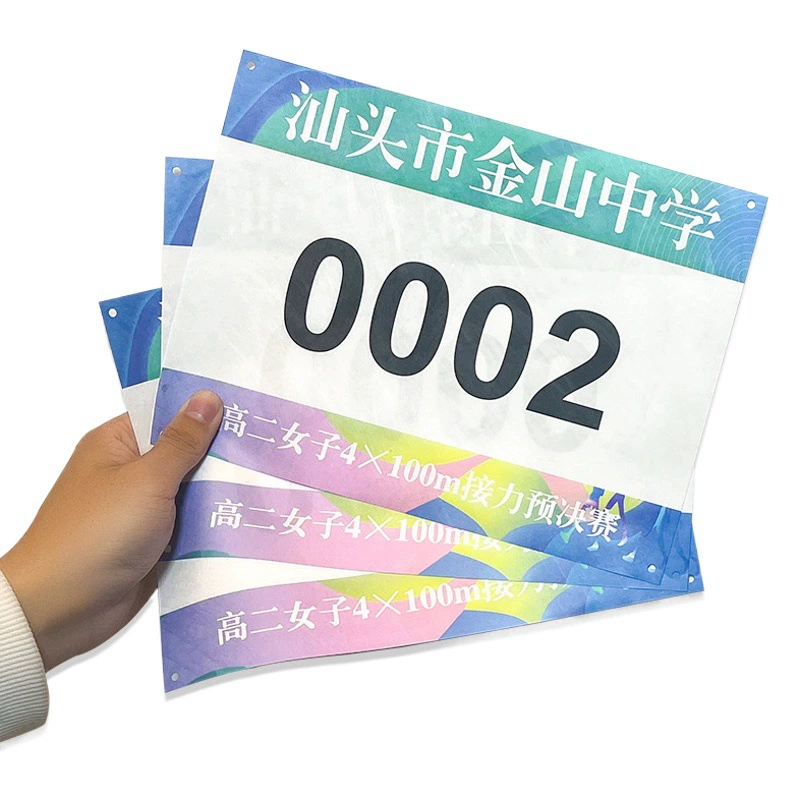 Выполненный на заказ номер ткани номера игр след спортсменов соревнования и номер ткани номера поля в запасе