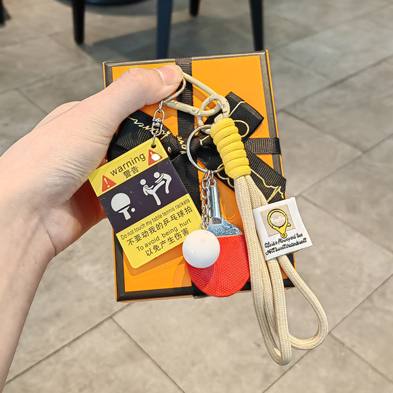 Kicking ping pong warning sign + big ping pong ball + khaki double rope + gift box