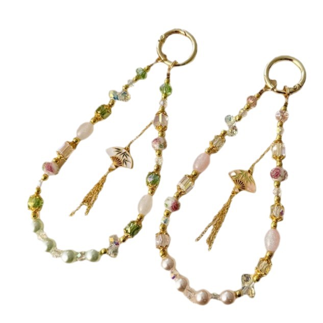 China ventilador de aleación de viento flange caja de teléfono móvil cuerdas manuales esmaltado cristal bolso de cadena de teléfono móvil colgante