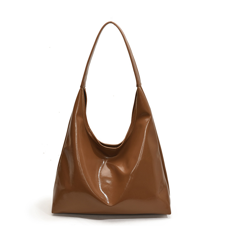 Bolsa de brazo retro de viaje para mujeres 2025 nueva moda popular bolso de hombro de cuero suave sensación de gran capacidad bolsa de mano