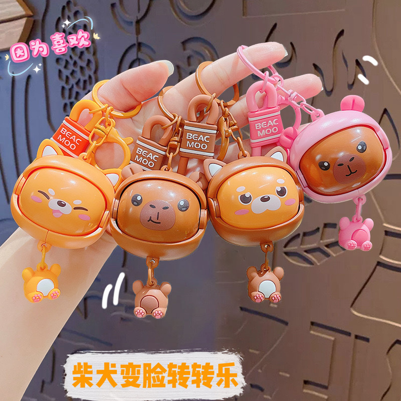 창조적 인 새로운 감압 차이 개 얼굴 변화 턴어라운드 음악 장난감 키 체인 여성 가방 펜던트 키 체인 선물 도매