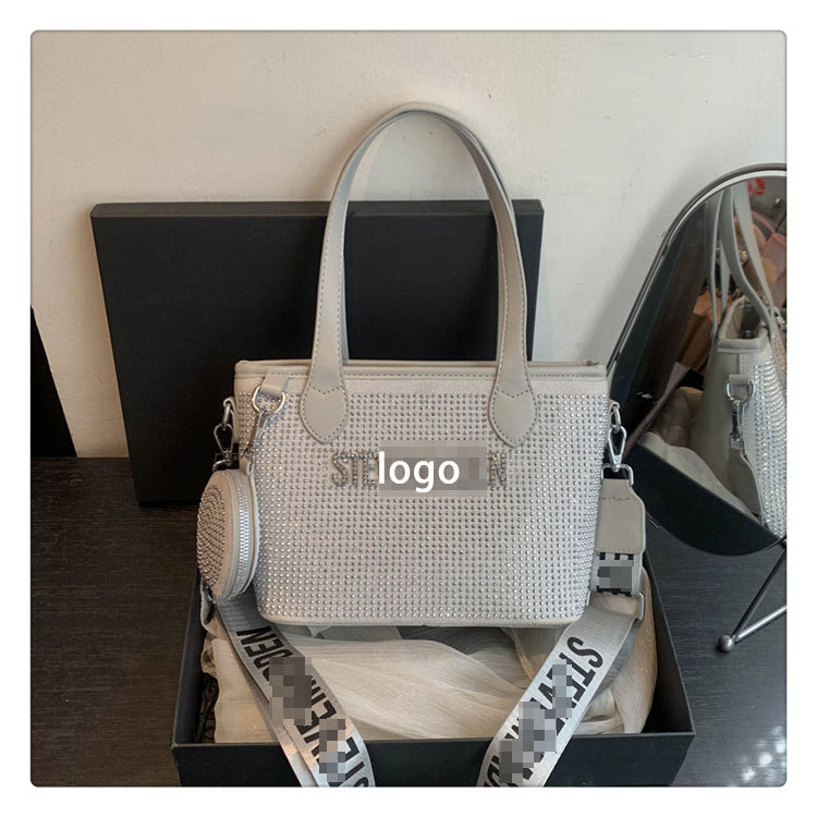 Bolso de letras de diamantes de imitación transfronterizos diseño de nicho femenino moda simple portátil popular 2025 nueva textura bolsa de mensajero
